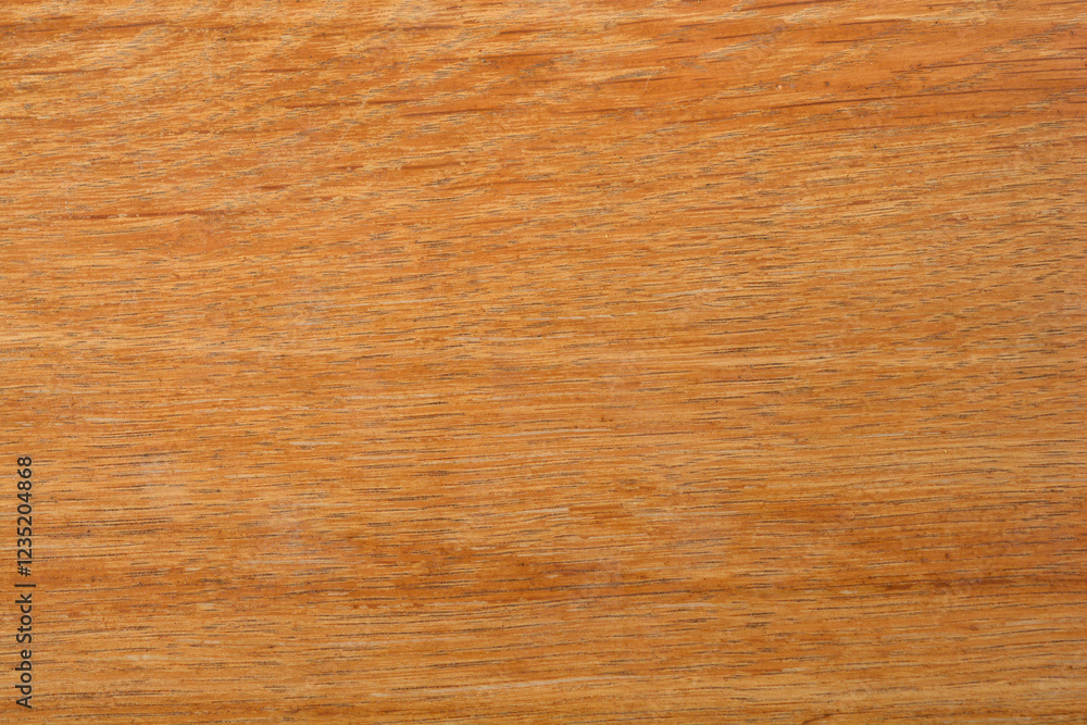 Naklejka premium A close-up shot of a textured, light brown wooden surface with a visible grain