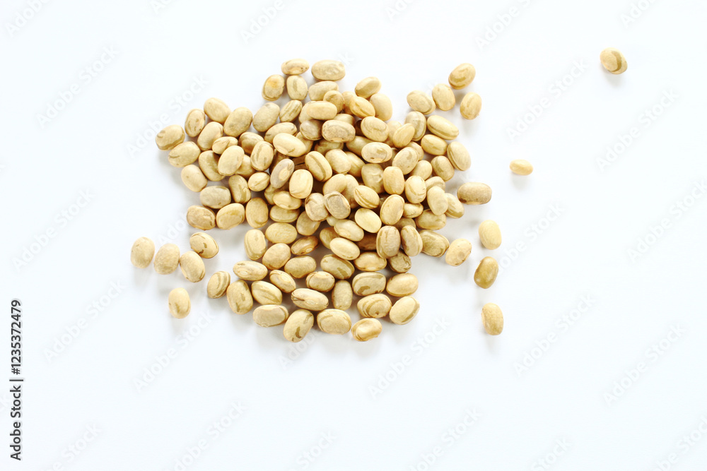 Carioca beans on the white background. Top view of brazilian grains. Carioca beans on the white background. Top view of brazilian grains.