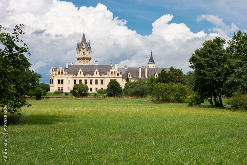 Grafenneg Castle in Austria in sunny summer day, meadow