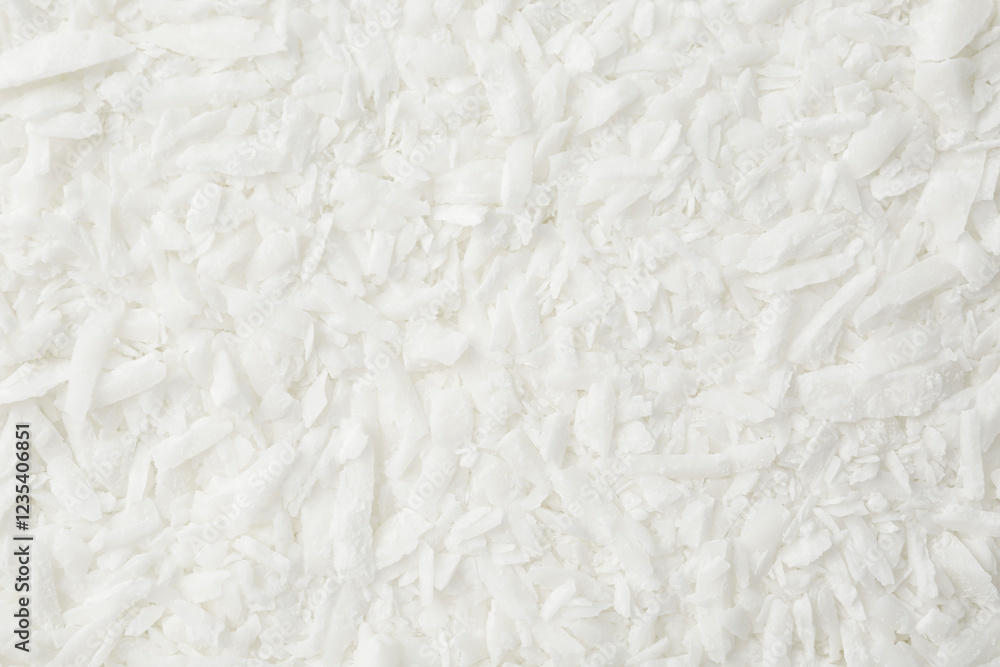 White soy wax flakes as background, closeup White soy wax flakes as background, closeup