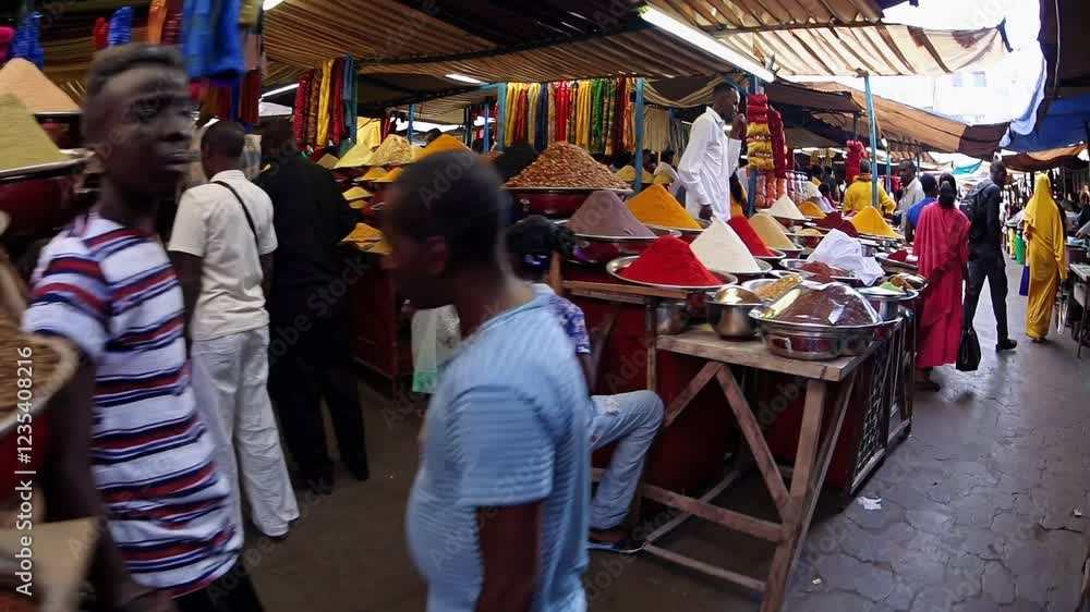 Brightly colored piles of spices arranged in metal bowls at a vibrant market with a lively and cultural atmosphere Brightly colored piles of spices arranged in metal bowls at a vibrant market with a lively and cultural atmosphere