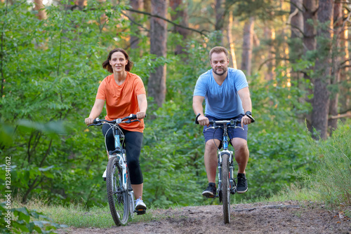 family relaxing together on a bike ride #1235411612