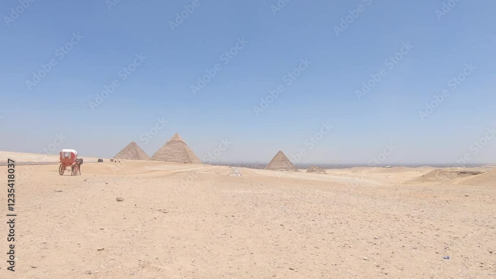Tourist on road towards Ancient Egyptian Pyramids of Giza ancient history site