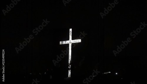 Illuminated Cross in the Darkness of Night