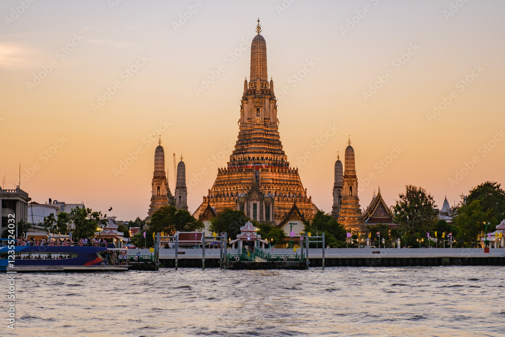 Majestic sunset over Wat Arun in Bangkok Thailand illuminating the Chao Phraya River Majestic sunset over Wat Arun in Bangkok Thailand illuminating the Chao Phraya River