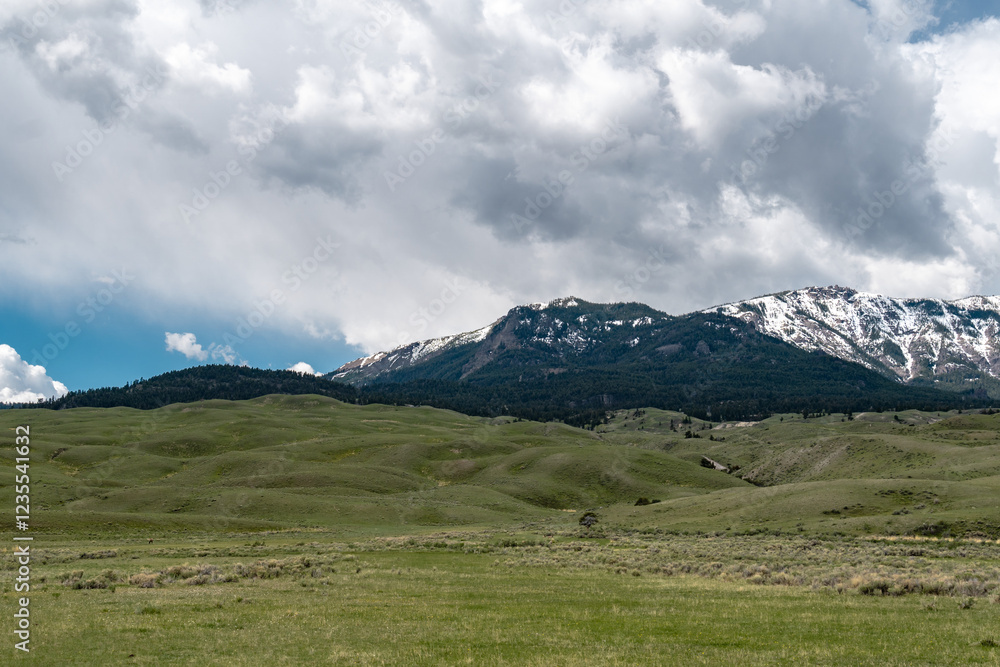 Fototapeta premium landscape in the mountains, bumpy terrain, hills, clouds