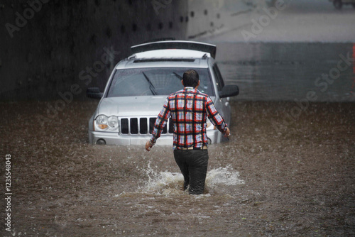 Driver gets stuck with his car in Marginal avenue during a big flood amid heavy rains in Sao Paulo, Brazil.