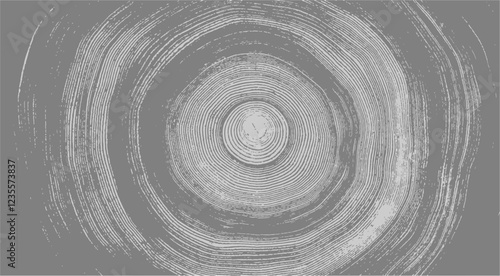 Gray ink stamp impression of end grain of wood slab. Tree rings art with texture and cracked surface.