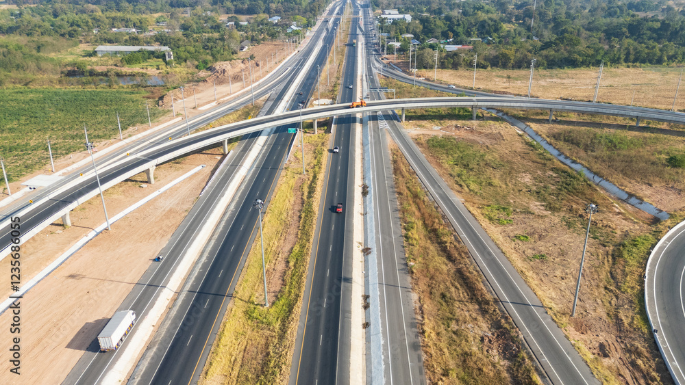 Drone shot aerial view of high angle view of intersection across the bridge against the countryside highway Drone shot aerial view of high angle view of intersection across the bridge against the countryside highway