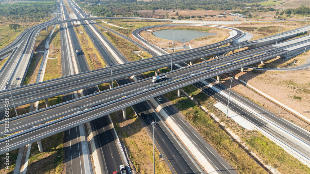 Drone shot aerial view of high angle view of intersection across the bridge against the countryside highway Drone shot aerial view of high angle view of intersection across the bridge against the countryside highway