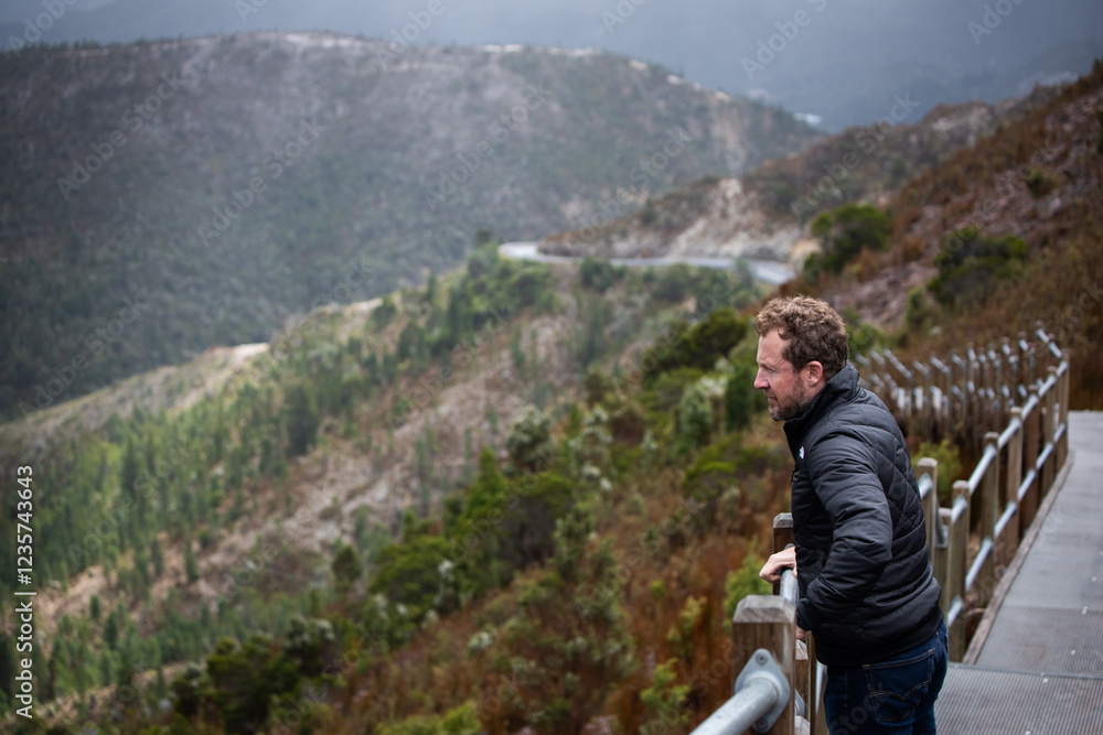 man behind walking path hike mountains cold winter jacket man behind walking path hike mountains cold winter jacket