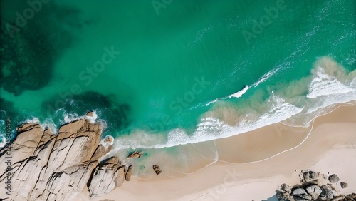 Blue ocean waves crash on the tropical shore photo