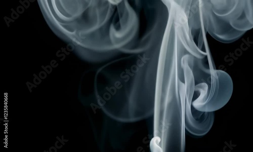 Realistic Smoke Wisps Rising Against a Black Background