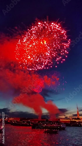 Beautiful fireworks at sunset over the water