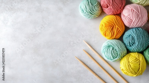 Colorful Yarn Knitting Needle Arranged Bright Surface photo