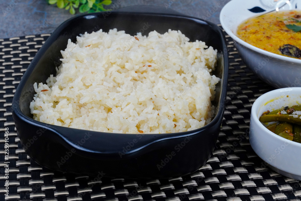 Moong Masoor Daal, Red and Yellow Lentil Curry with rice. Rice in a bowl
Moong Masoor Daal, Red and Yellow Lentil Curry with rice. Rice in a bowl