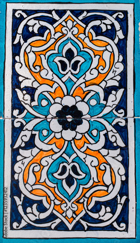 traditional blue and orange uzbek ornament, central asia pattern in east, national mosaic background photo