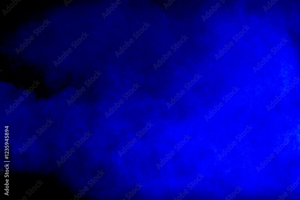 Fototapeta premium Blue cloud of smoke is floating in the air