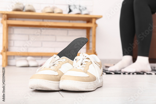 Pair of stylish sneakers wi...