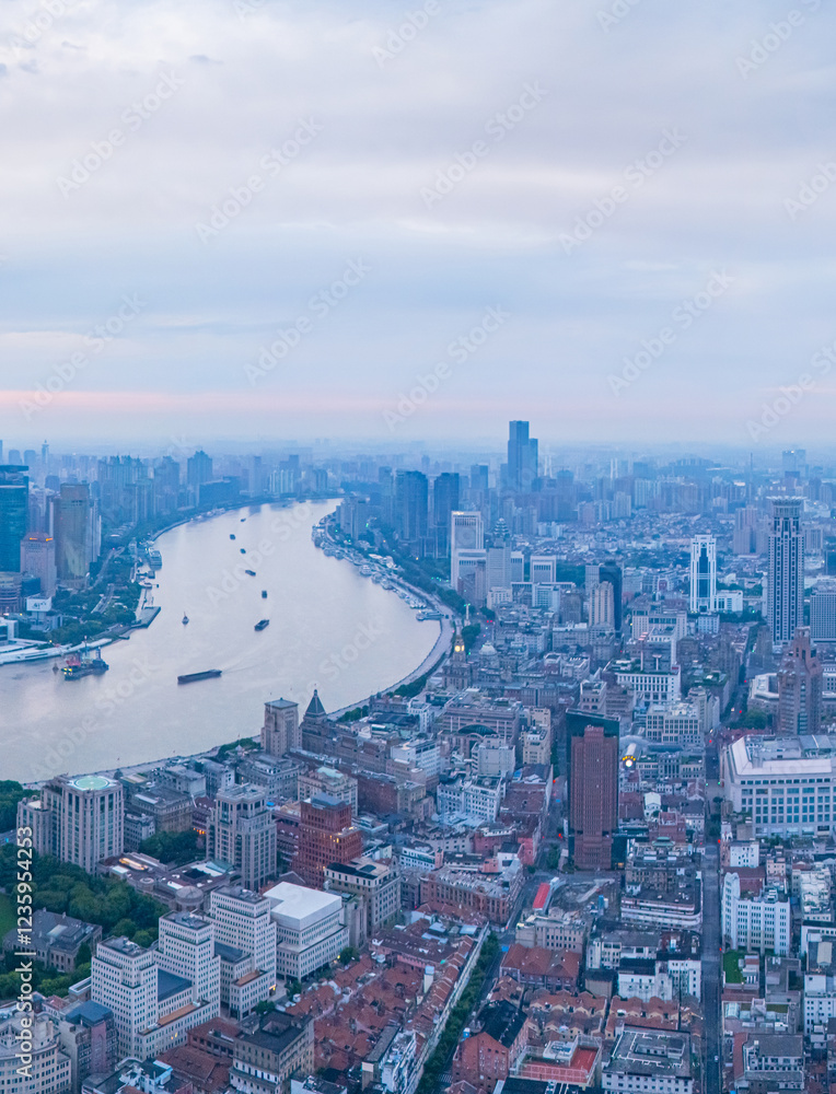 Obraz premium Aerial View of Shanghai skyline at sunrise with the Winding River