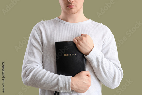 Young man with Holy Bible p...