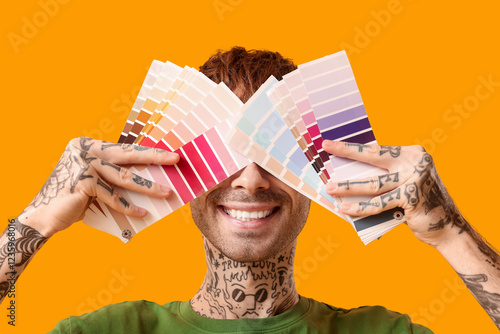 Young man covering face wit...