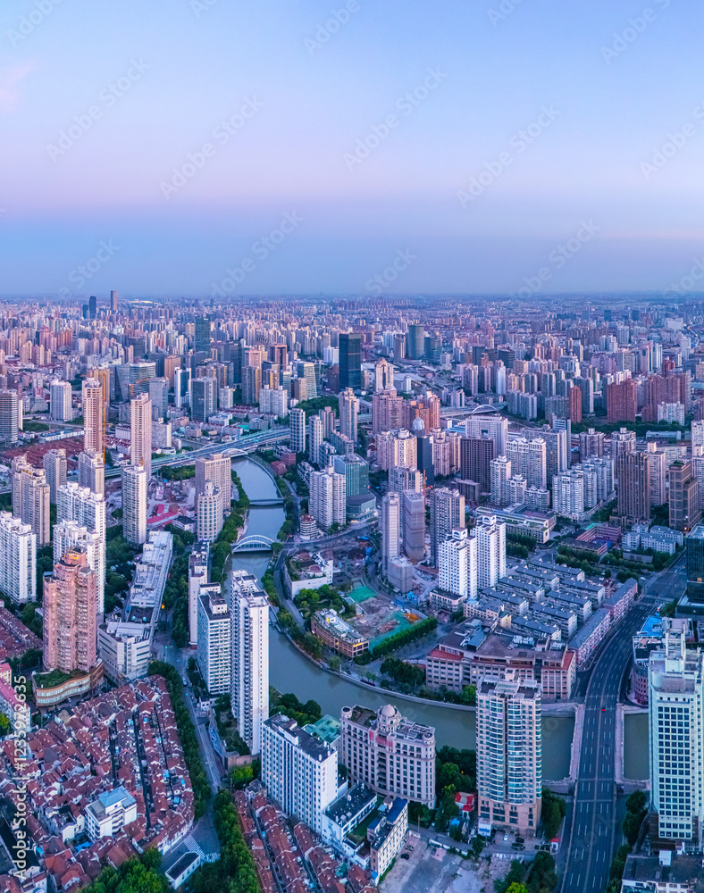 Fototapeta premium Aerial view of high-rise buildings and residential houses on the Bund in Shanghai