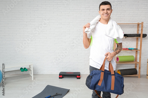 Young man with sports bag  ...
