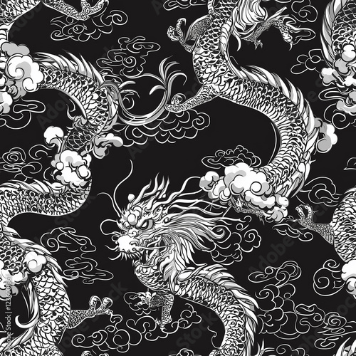 Intricate black and white dragon pattern interwoven with clouds on a dark background. photo