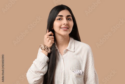 Happy woman with silk scrun...