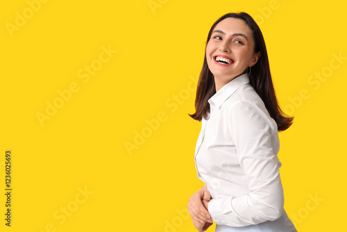 Smiling young woman on yell...