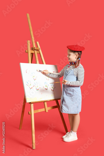 Little artist painting on c...