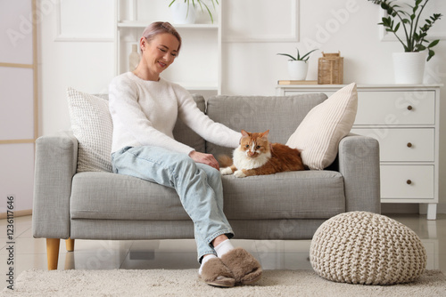 Relaxed woman petting orang...