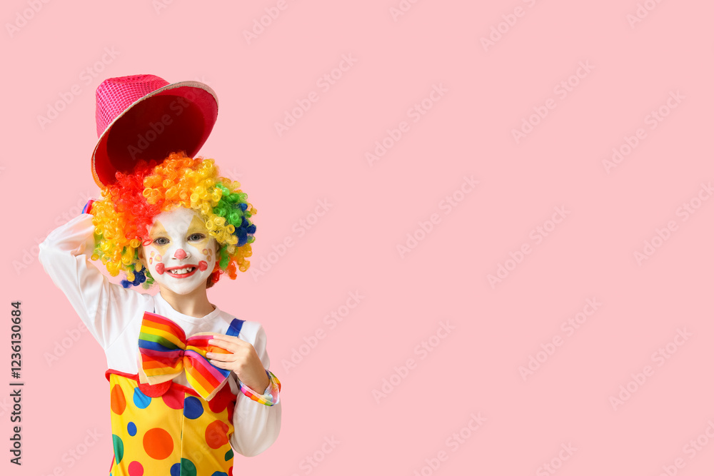 Little girl in clown costume with hat on pink background. April Fools' Day celebration Little girl in clown costume with hat on pink background. April Fools' Day celebration