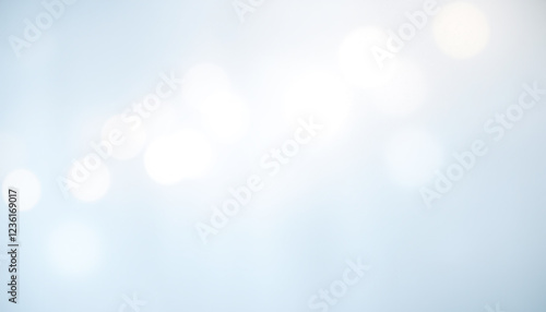 Soft blue bokeh abstract background with light blurred circles and a dreamy glowing effect, creating an elegant modern design for artistic visuals, branding, or digital compositions.