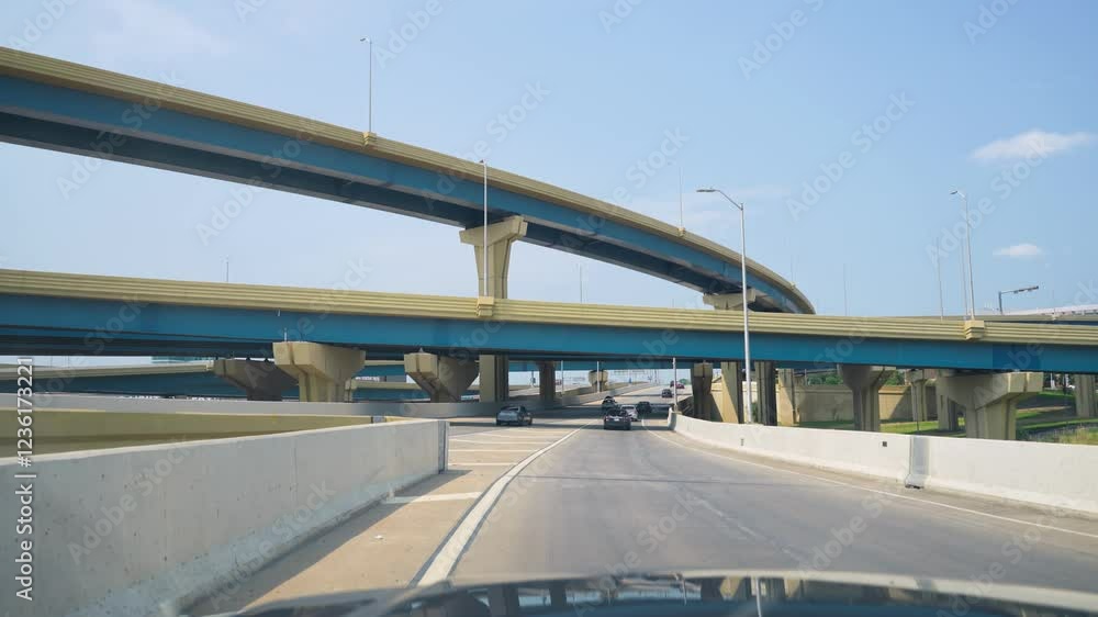 Car driving near an interstate junction on a clear day Car driving near an interstate junction on a clear day