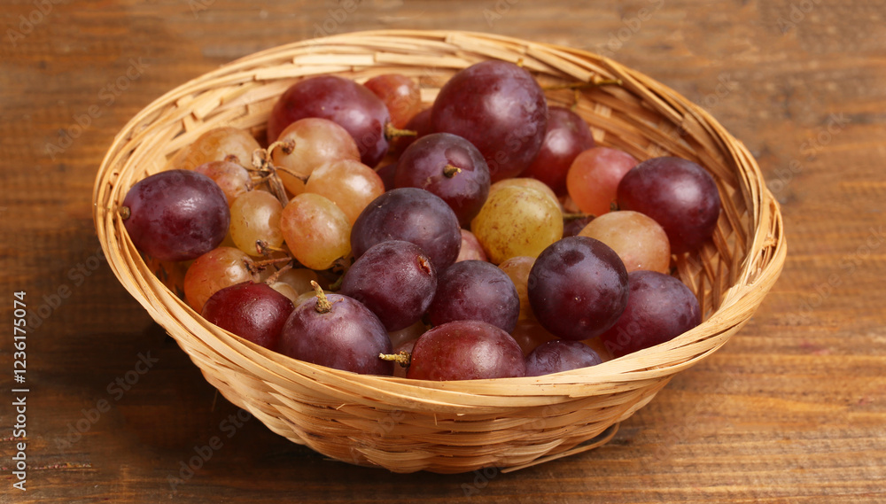 bowl of grapes on wooden background bowl of grapes on wooden background