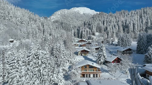 aerial view of snowy winter wonderland in Chamonix, France, Christmas background of ski resort with alpine chalets, snowy winter forest in French Alps
