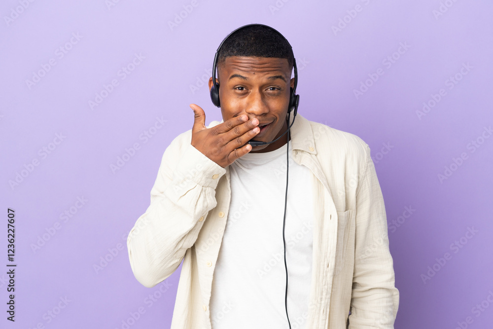 Telemarketer latin man working with a headset isolated on purple background happy and smiling covering mouth with hand Telemarketer latin man working with a headset isolated on purple background happy and smiling covering mouth with hand