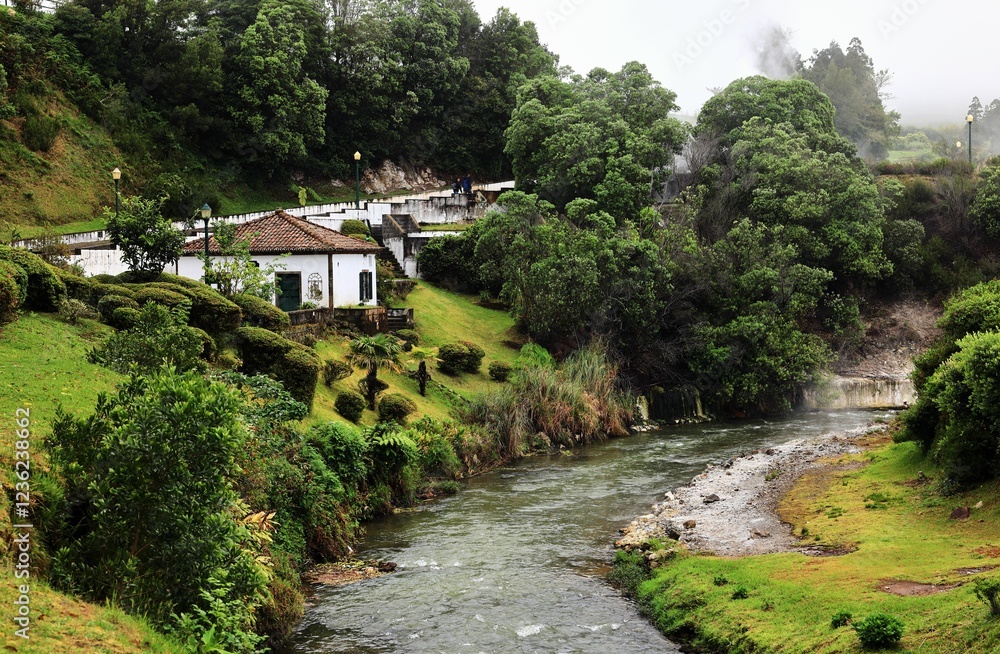 Serene countryside with river and house Serene countryside with river and house