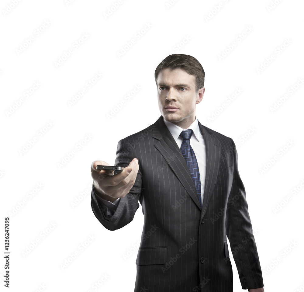 Businessman in a formal suit holding a smartphone, pointing it forward. Isolated on a clean white background. Concept of communication and technology Businessman in a formal suit holding a smartphone, pointing it forward. Isolated on a clean white background. Concept of communication and technology