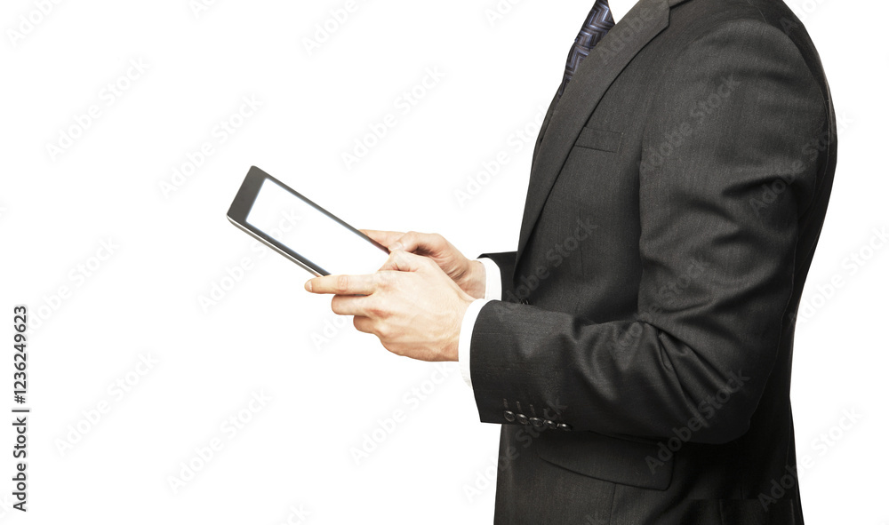 Businessman holding a tablet in both hands, wearing a formal suit, isolated on a white background. Concept of technology and business communication Businessman holding a tablet in both hands, wearing a formal suit, isolated on a white background. Concept of technology and business communication