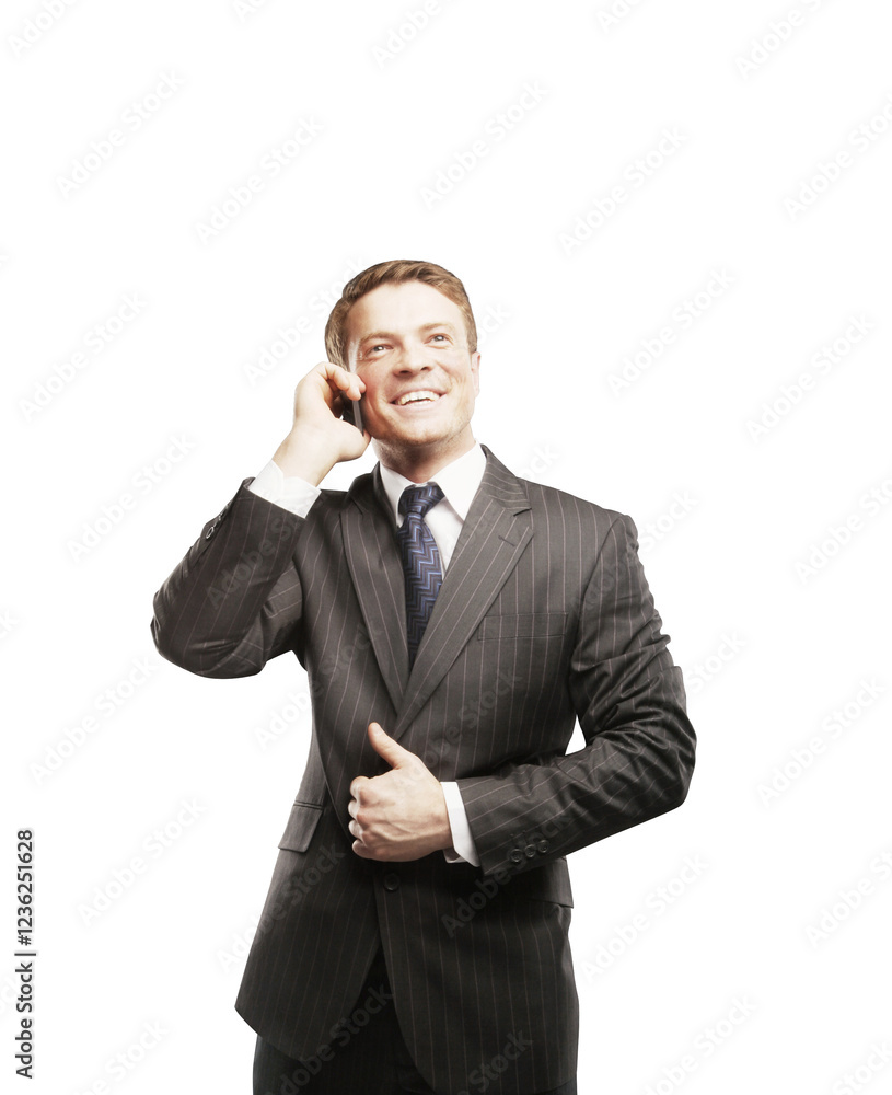 Smiling businessman in a pinstripe suit talking on a smartphone, standing on a white background. Professional communication and corporate concept Smiling businessman in a pinstripe suit talking on a smartphone, standing on a white background. Professional communication and corporate concept