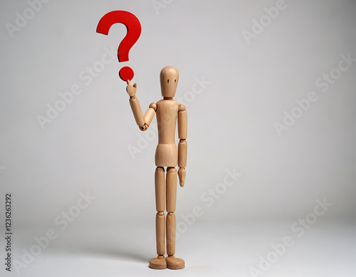 wooden mannequin with question mark