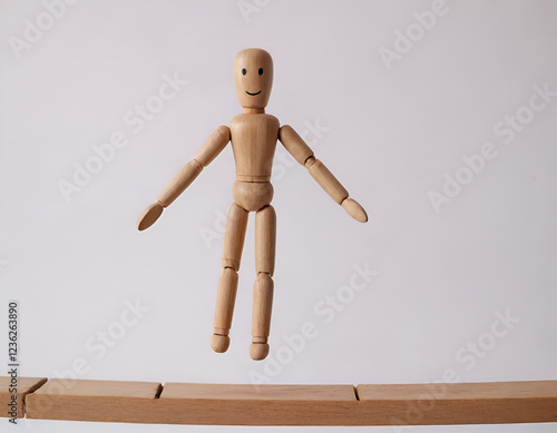 wooden mannequin junping on a bridge