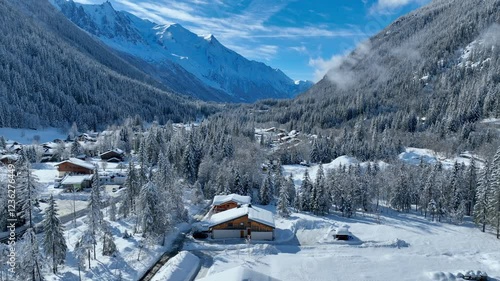 aerial view of Chamonix in winter, French ski resort in the Alps, snowy frosty alpine landscape in Chamonix Valley, drone view of alpine village