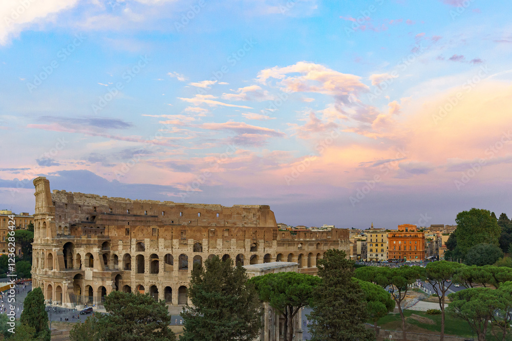 Obraz premium The great Roman Colosseum also known as the Flavian Amphitheater on a sunny day with deep blue sky, beautiful clouds and no people visible 