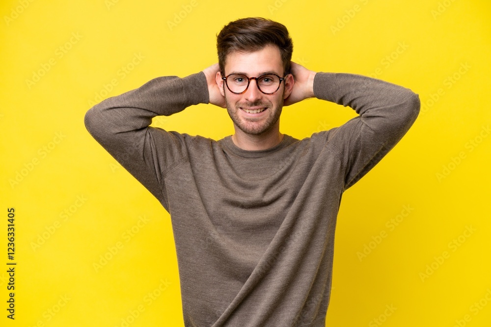 Young caucasian man isolated on yellow background laughing Young caucasian man isolated on yellow background laughing