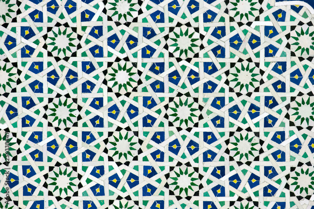 A detailed Islamic geometric mosaic featuring vibrant colors and symmetrical patterns. The design showcases traditional arabesque motifs with star shapes and interwoven lines A detailed Islamic geometric mosaic featuring vibrant colors and symmetrical patterns. The design showcases traditional arabesque motifs with star shapes and interwoven lines