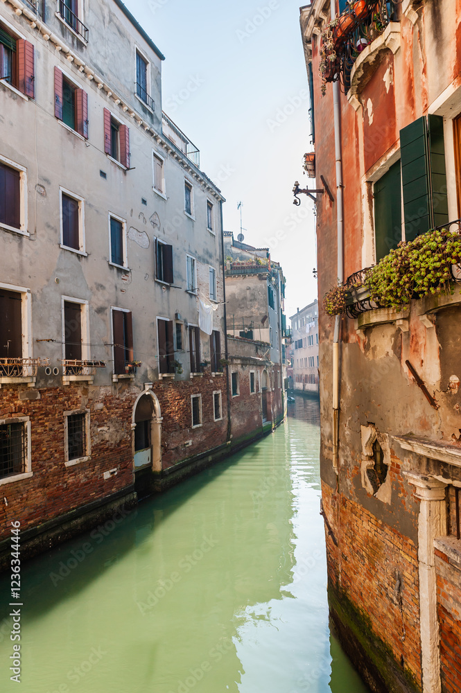 Old venetian architecture on the canal in Venice, Italy.